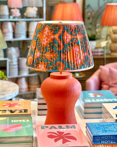 Orange and Blue Ikat Lampshade on an Orange Julian Chichester Lamp