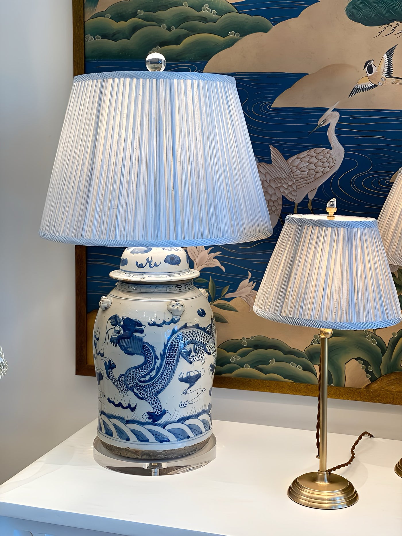 Fermoie light blue strie lampshade on a blue and white jar lamp