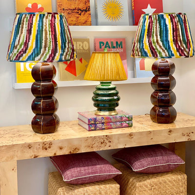 Hwang Bishop lamps with ikat lampshades and Fermoie club yellow 