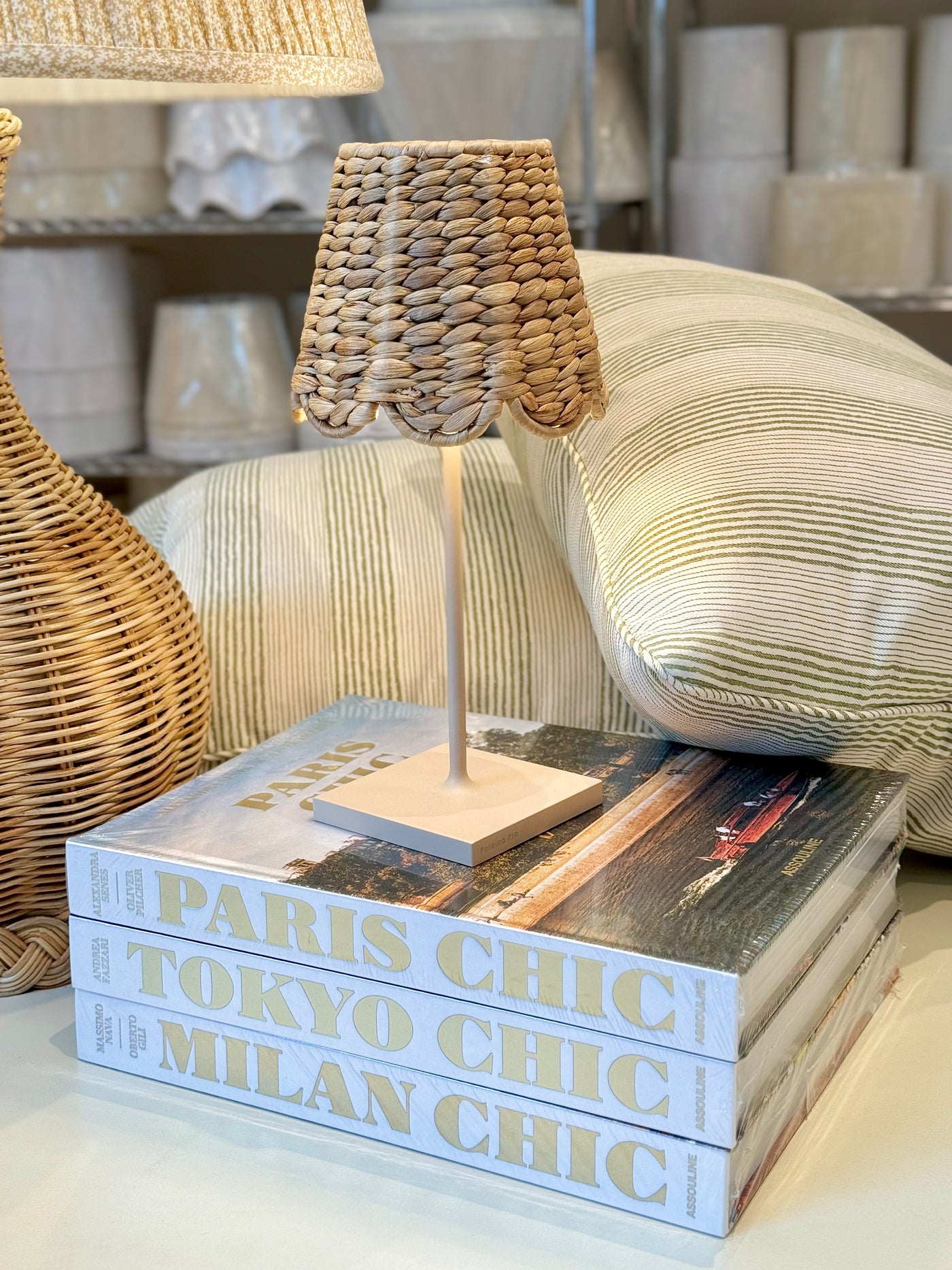 Mini Poldina table lamp with scalloped seagrass shade.