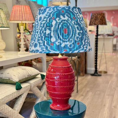 Blue and Red Ikat lampshade on a red lamp