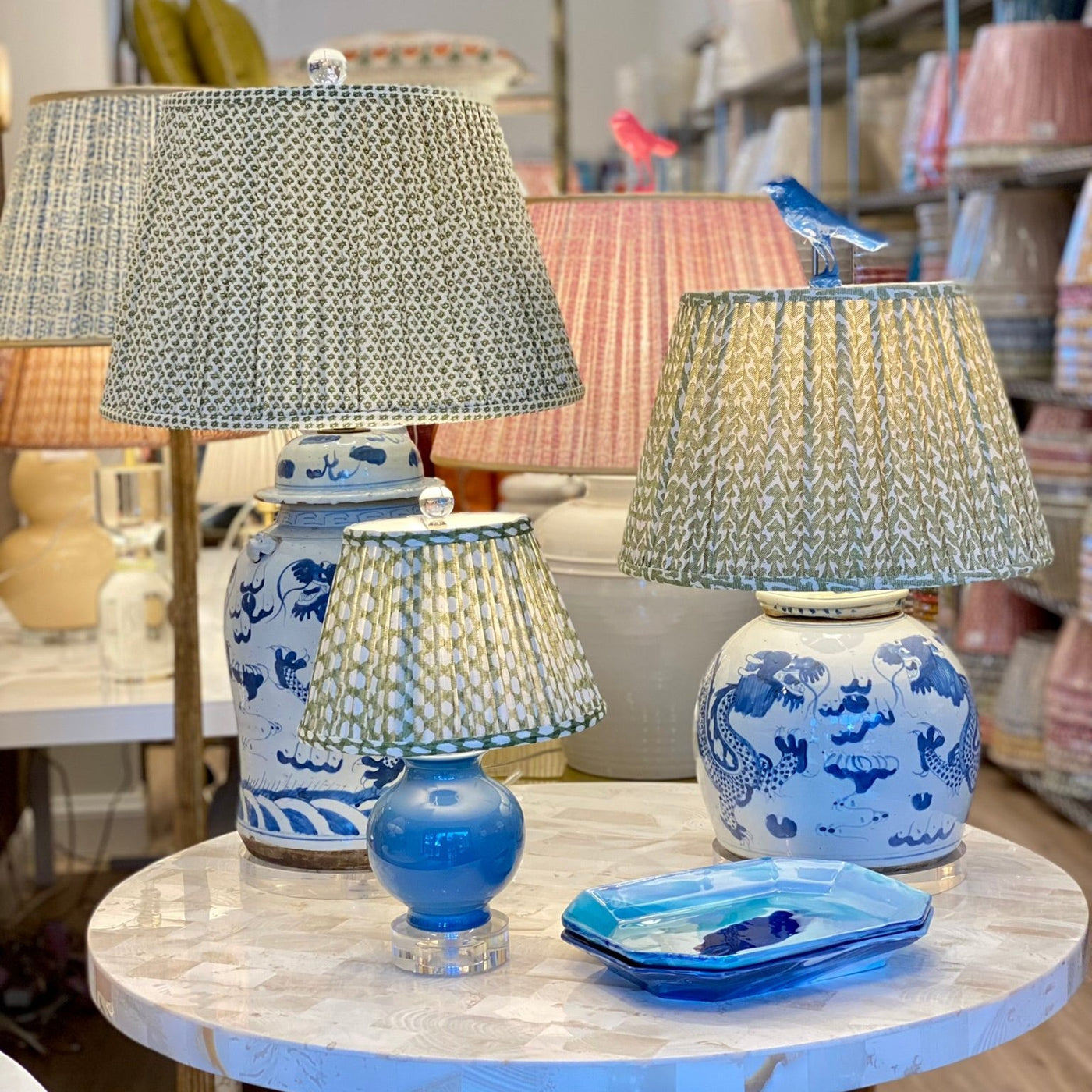 blue and white lamps with green fermoie lampshades