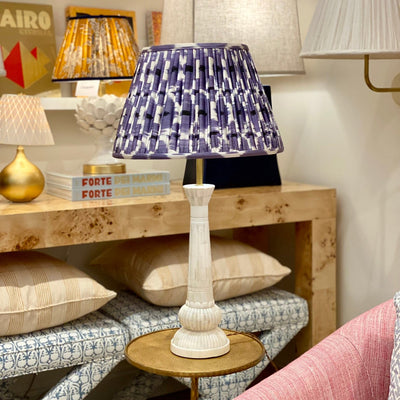 Purple ikat lampshade on a bone lamp