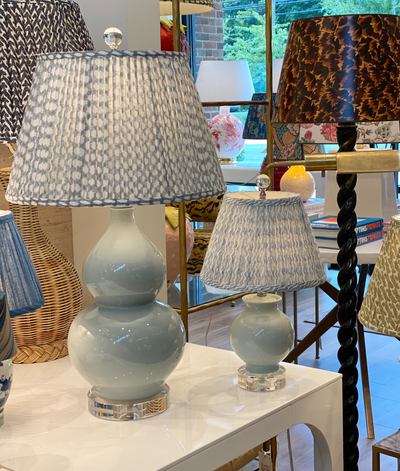 Pale blue lamps and Fermoie lampshades