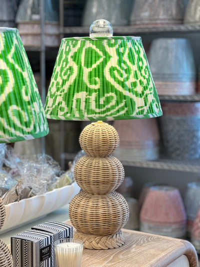 Green ikat lampshade on a triple gourd lamp