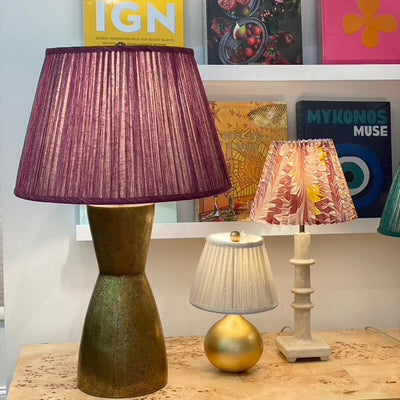 Large brass lamp and fuchsia lampshade