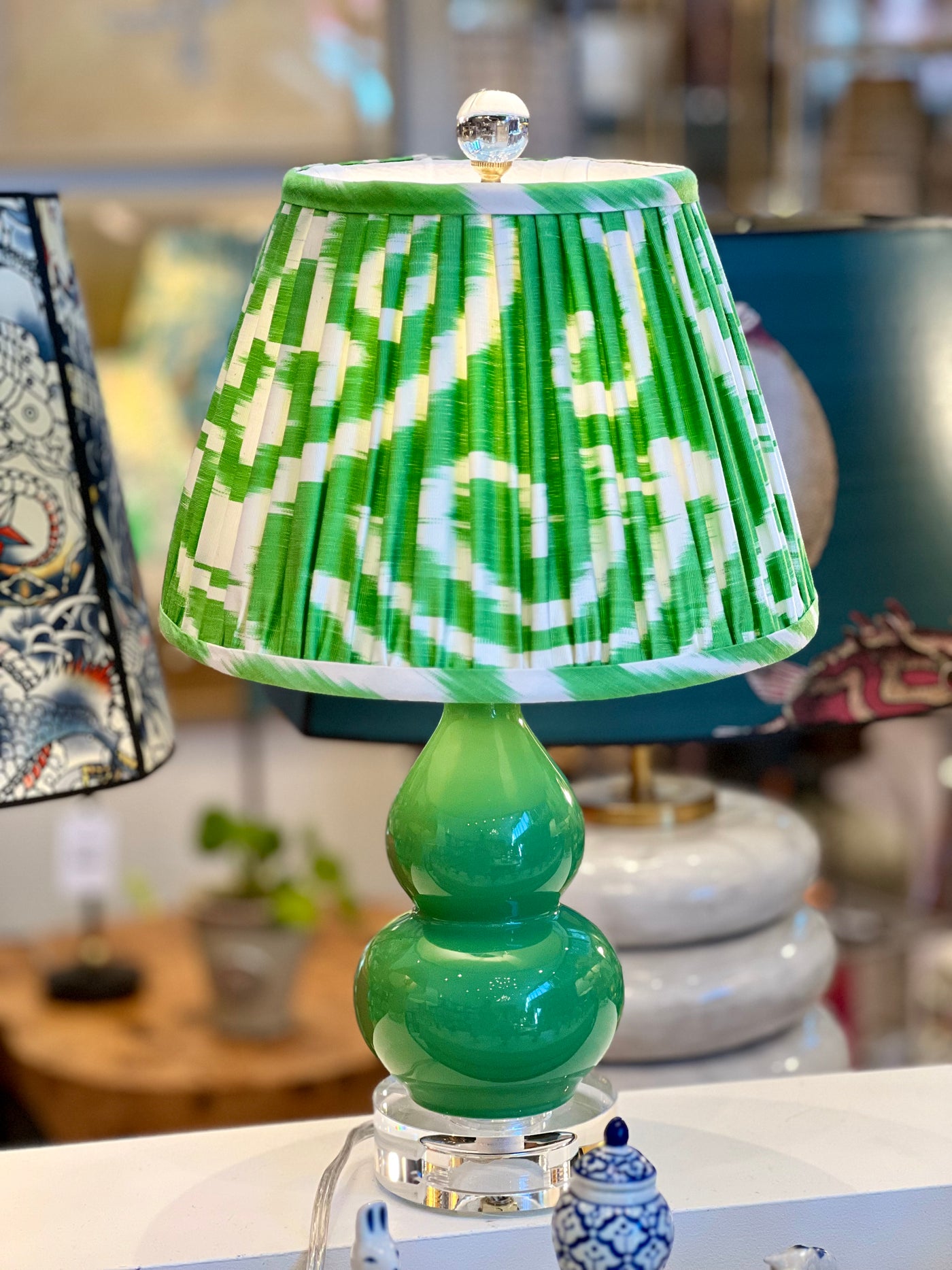 green mini lamp with green and white ikat lampshade