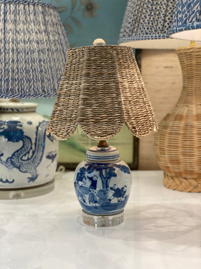 Scalloped seagrass lampshade on a small blue and white lamp