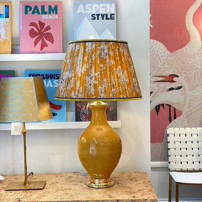 Yellow block print lampshade and Paul Schneider lamp