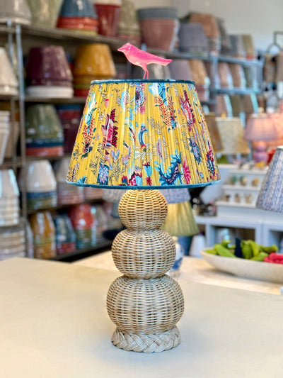 Yellow block print lampshade on a triple gourd lamp